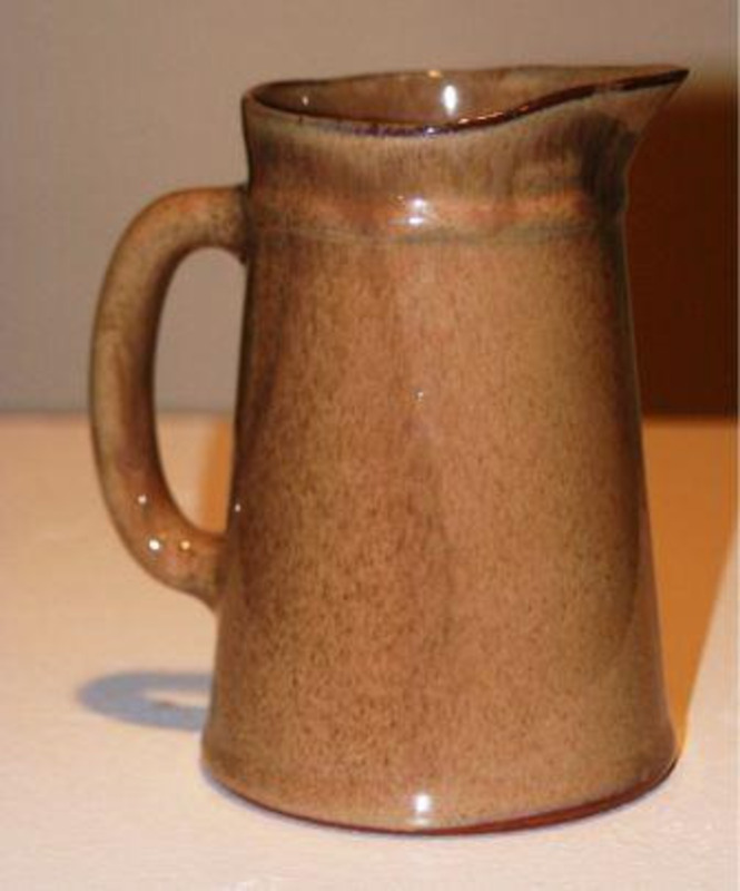 Earthenware pitcher that has been glazed. This pitcher was made in Vermont.