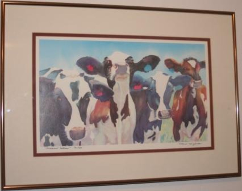 Lithograph of four cows in a field bordered framed with a red and cream matte. Housed in Maui, Hawaii.