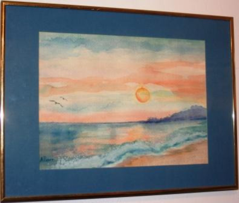 Painting showing the setting sun above ocean waves while two birds fly in the sky. The painting is mounted with a blue matte.