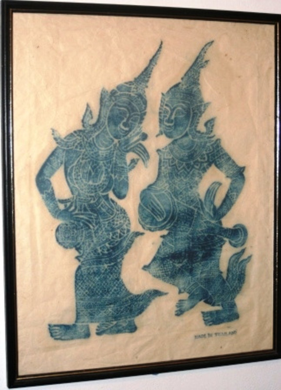 Batik dyed cloth depicting a male and female figure playing drums. Labeled "Made Thailand" in the corner.