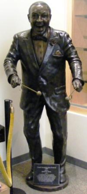 Life-sized bronze statue of Lionel Hampton holding vibraphone mallets.