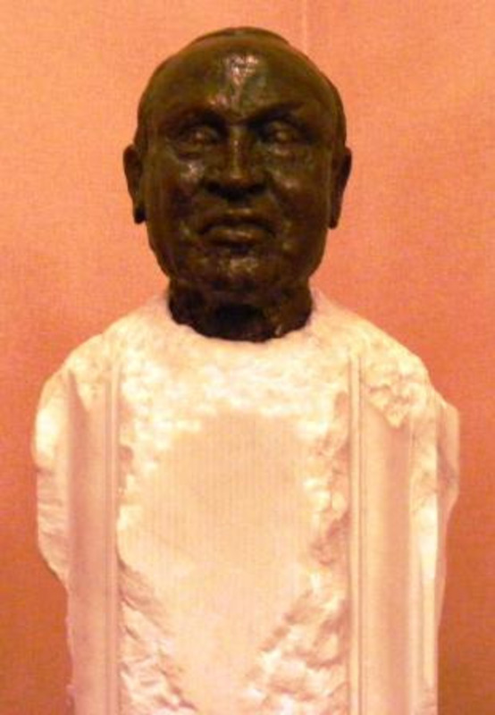 Sculpted bust of Lionel Hampton on a roughly shaped white base.