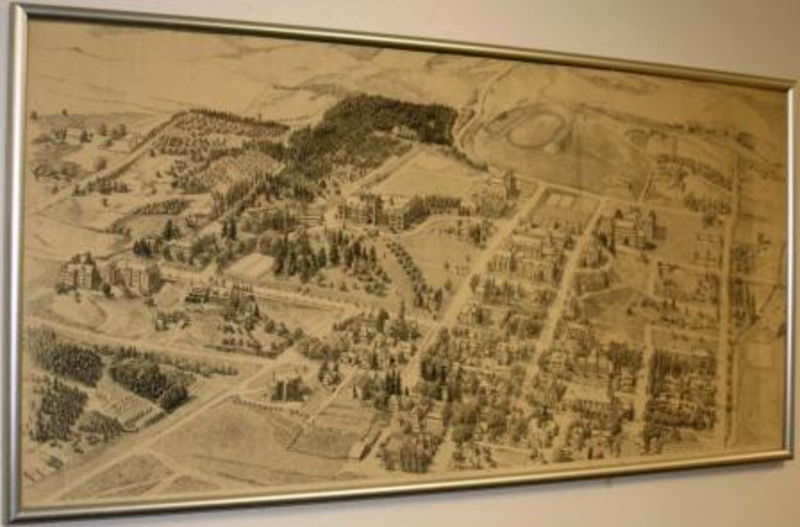 Ink drawing of an aerial view of the University of Idaho campus in 1936. Reframed in a black wood frame.