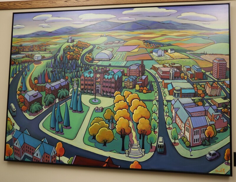 Painting showing a colorful view of the university of Idaho Administration Building and the surrounding campus.