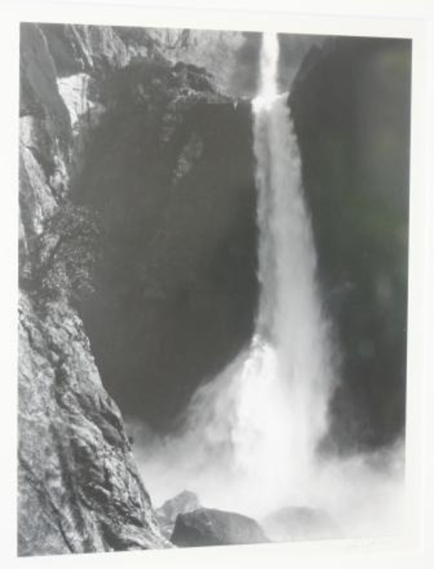 Photograph of water cascading into the pool as the base of Lower Yosemite Falls in Yosemite National Park.