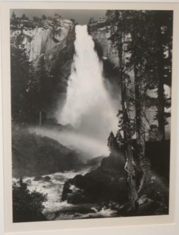 Photograph of a rainbow above the river flowing from the Nevada Fall in the Yosemite Valley.