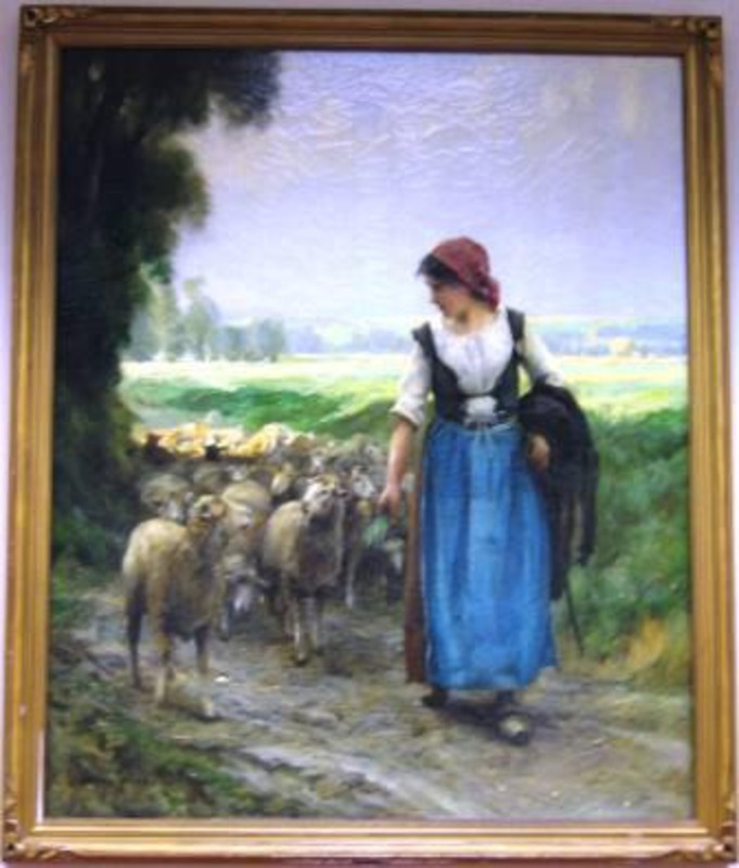 Painting of a woman in a blue skirt with a red head scarf leading a flock of sheep. The canvas is mounted in a decorative gilt frame.
