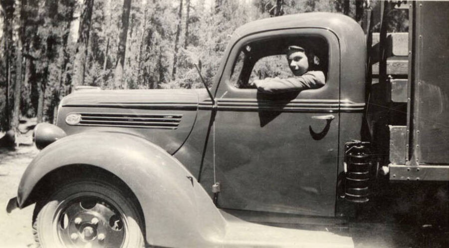 Photo of Mike McKinney in truck. Writing below the photo reads: 'Me and 'Ha-Ha''.