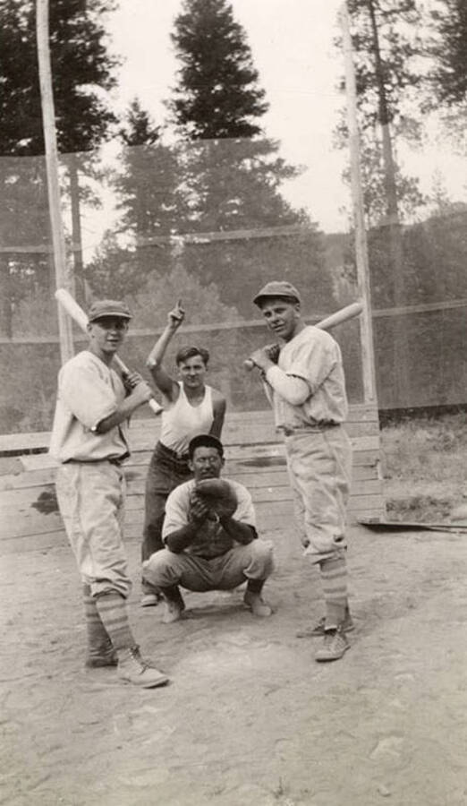 A group of CCC men posing over home plate.