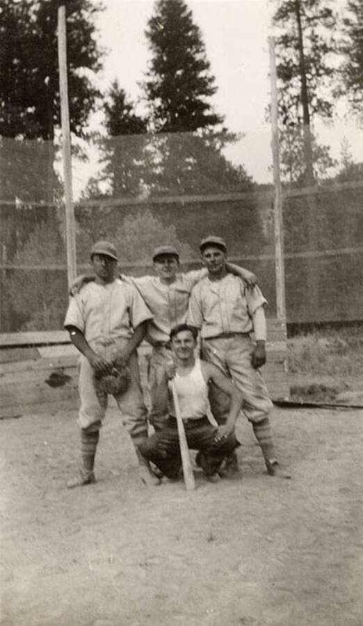 A group of CCC men posing over home plate.