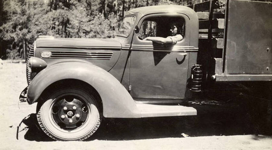 CCC man in a truck. Writing under the photo reads: ''Tex' and Minnie'.