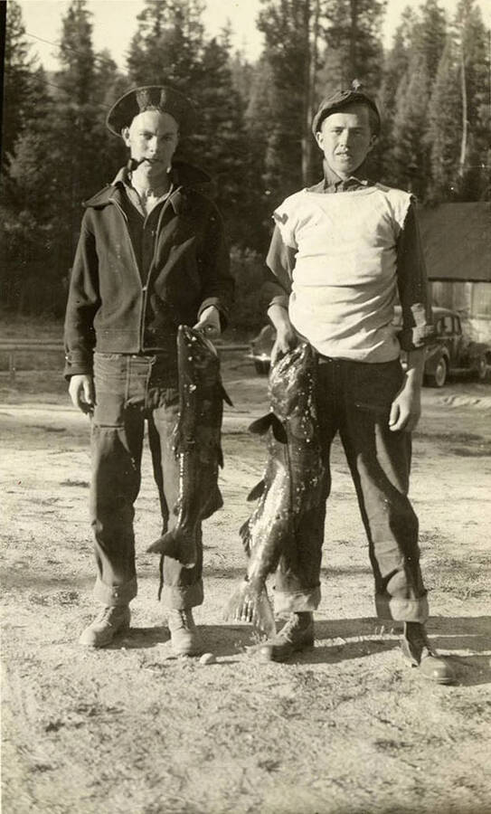 Two CCC men with their fish that they caught. Writing under the photo reads: 'Me - 'Tex''.