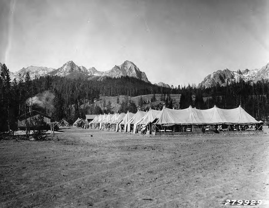 View of Redfish Lake CCC Camp and Redfish Lake, Idaho. Sawtooth Mountains loom in the background.
