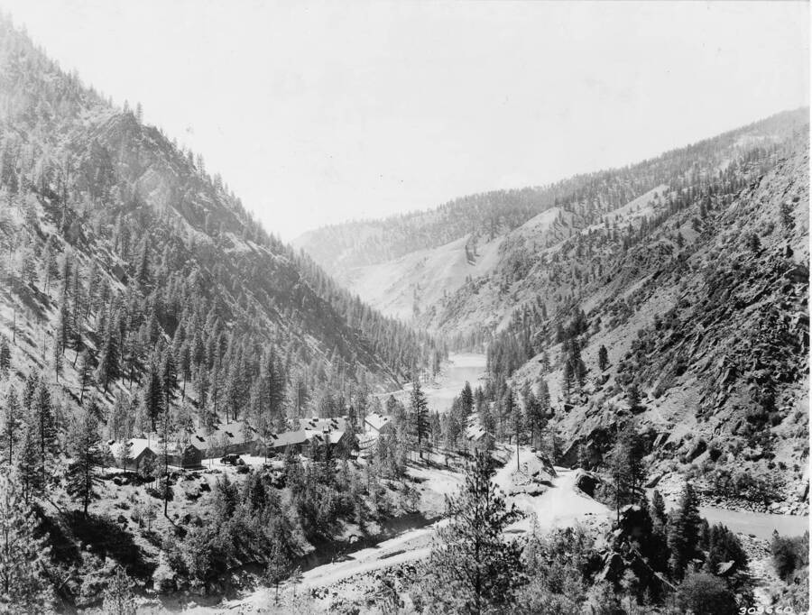 A view of CCC French Creek Camp, F-109, and French Creek in the Nezperce National Forest, Idaho. Back of photo reads: 'CCC Camp at French Creek, Idaho, Nezperce National Forest, Idaho. Camp now closed. Credit Line! This print may be reproduced with the following credit line 'Photo by U.S. Forest Service'.'