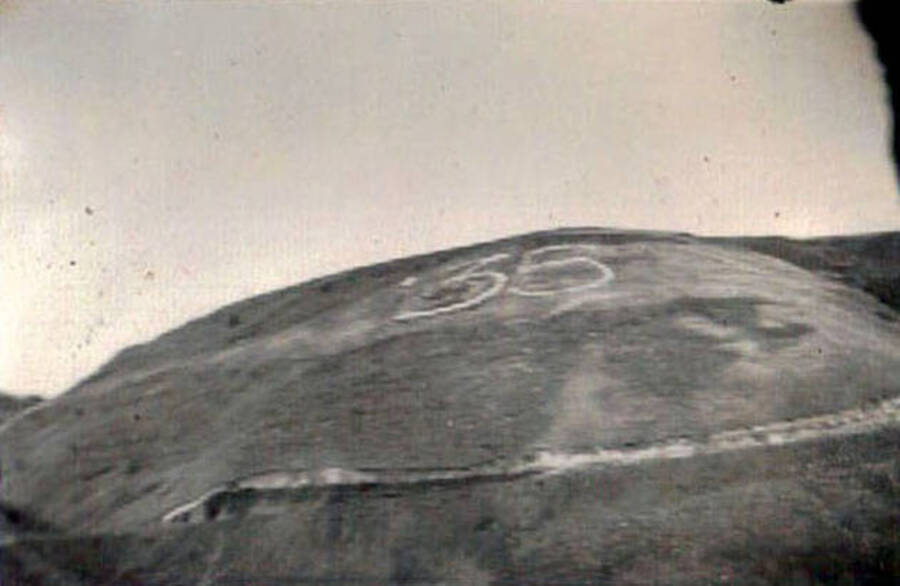 Photo of the side of a hill taken from below. Writing on the hill reads: '35'. Writing under the photo reads: 'Lewiston Hill'