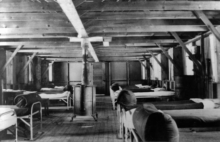 Interior of barrack #5 from CCC Camp S-223. Writing beneath the photo reads: '1850.0013. CCC Camp S-223 McCall, ID 1935 Interior of Barracks #5 Author: David Lyon Print (x2) (Negative in '1850 D. Lyon Negatives') 9A & 15A Color'.