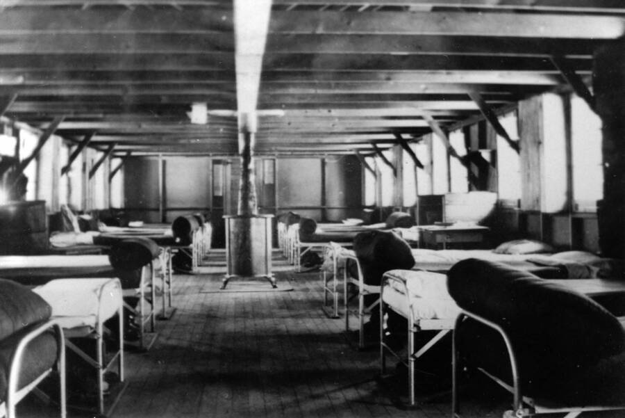 Interior of barracks from CCC Camp S-223. Writing beneath the photo reads: '1850.0014. Barracks from norther interior, Camp S-223, McCall, 1935