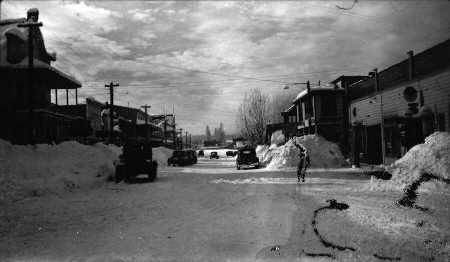 Downtown McCall in winter, facing west. Writing beneath the photo reads: '1850.0046. McCall, facing west, in winter, 1935-36.'