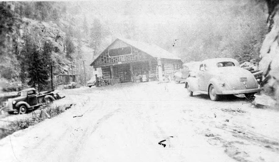 A photograph of French Creek Inn with cars parked in front and to the side of the main building. Writing beneath photo reads 'Photo No. 1850.0050. French Creek Inn, Camp French Creek, 1939 (?)'