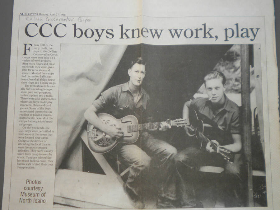 Newspaper article and picture of guitar players at Deception Creek Camp, Coeur d'Alene Press, published April 27, 1998