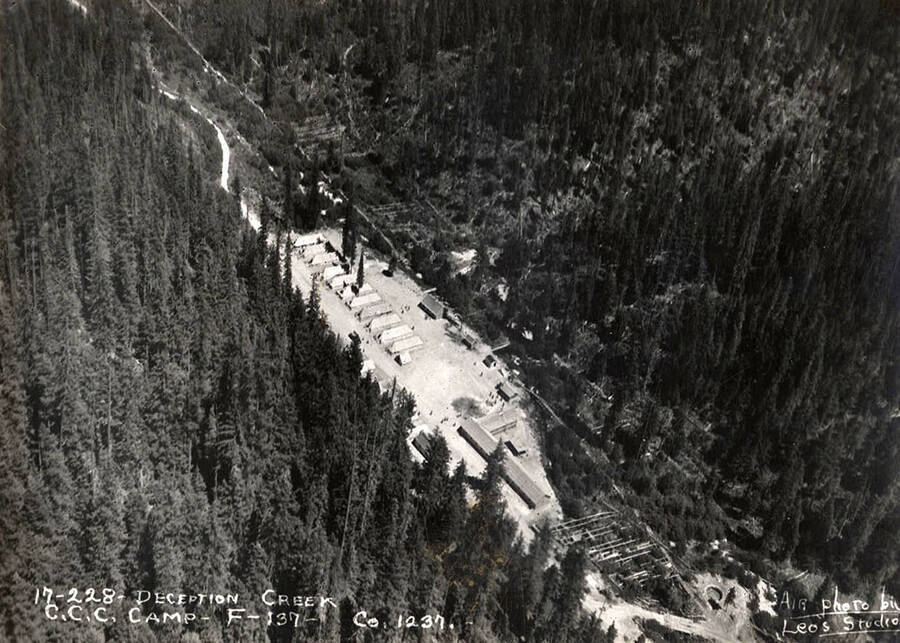 Aerial view of Deception Creek CCC Camp. Writing on the photo reads: '17-228 Deception Creek CCC Camp F-137 Company 1237 Air photo by Leo's Studio'.