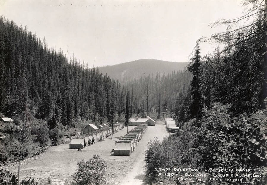 View of Deception Creek CCC Camp. Writing on the photo reads: '22-109 Deception Creek CCC Camp F-137 Company 545 Coeur d'Alene, ID Photo by Leo's Studio'.