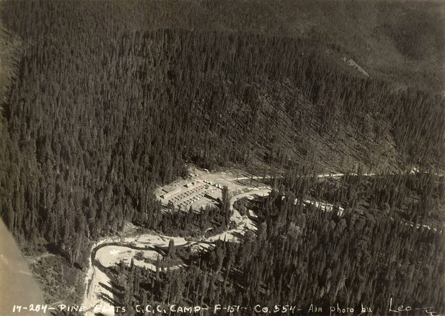 Aerial view of Pine Flats CCC Camp. Writing on the photo reads: 'Pine Flats CCC Camp F-151 Company 554 Air photo by Leo'.