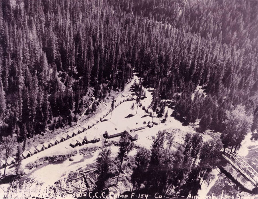 Aerial view of Devils Elbow CCC Camp. Writing on the photo reads: 'Devils Elbow CCC Camp F-154 Company __ Air photo by Leo's Studio'.