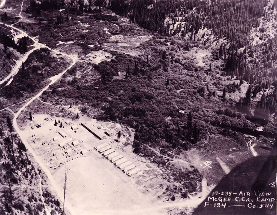 Aerial view of Magee CCC Camp. On the right side of the photo there is a geoglyph that reads F 134. Writing on the photo reads: 'Air view, McGee CCC Camp F-134 Company 544'.