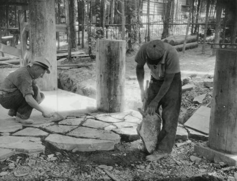 Workers laying floor for Rocky Point stove shelter at Heyburn State Park
