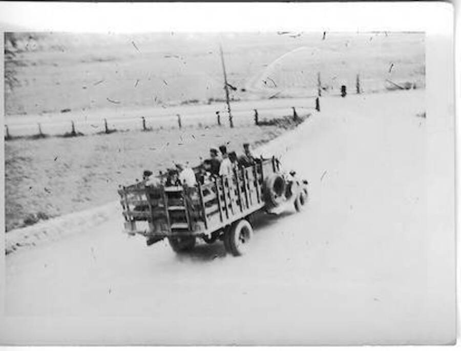 Men in open truck on way to fire. Camp Smith Ferry, 1939. Captioned: 'to fire'