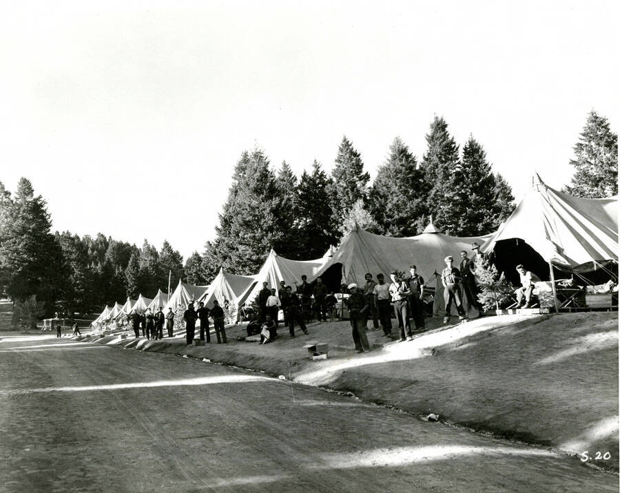Tents and enrollees along road, Camp Shafer Butte. Idenfied as Spike  Camp Shafter Butte, Idaho on back