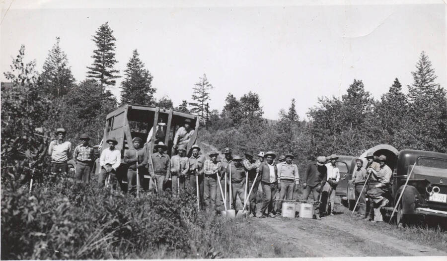 Work crew with shovels and vehicles, Fort Hall camp