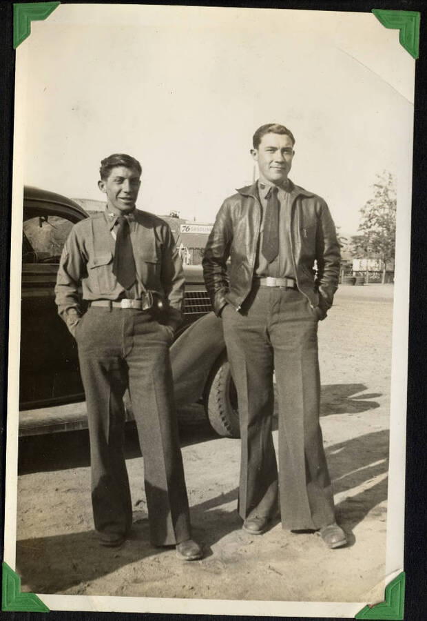 Two men in military uniform. SCS-1, C-1503. From the Paul Saft photographic album, SCS-1, C-1503, 1938-39, depicting camp life, taken mostly in the Moscow, Lewiston, Robinson Lake areas.