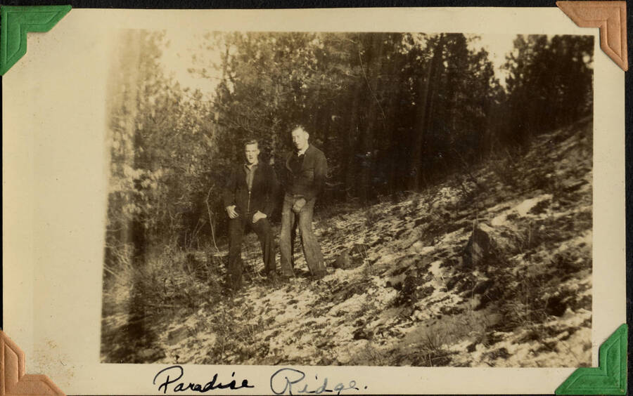 Two men in jackets, captioned: 'Paradise Ridge'. From the Paul Saft photographic album, SCS-1, C-1503, 1938-39, depicting camp life, taken mostly in the Moscow, Lewiston, Robinson Lake areas.