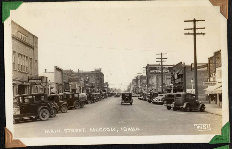 Moscow, Idaho, looking north on Main Street. Captioned 'Main Street, Moscow, Idaho. From the Paul Saft photographic album, SCS-1, C-1503, 1938-39, depicting camp life, taken mostly in the Moscow, Lewiston, Robinson Lake areas.