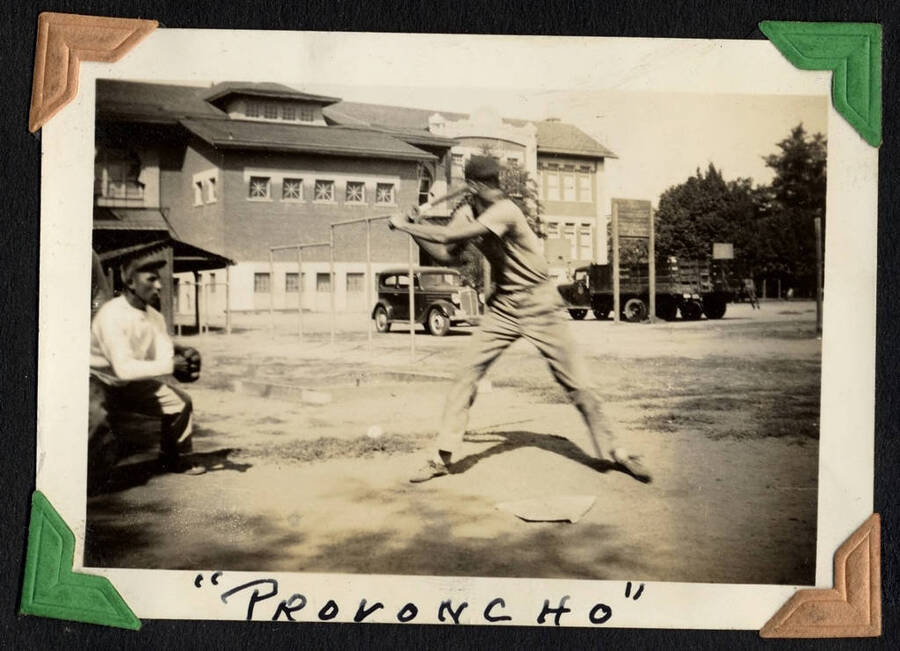 Batter and catcher at the plate. Captioned 'Proroncho'. Lewiston, Idaho. SCS-1, C-1503. From the Paul Saft photographic album, SCS-1, C-1503, 1938-39, depicting camp life, taken mostly in the Moscow, Lewiston, Robinson Lake areas.