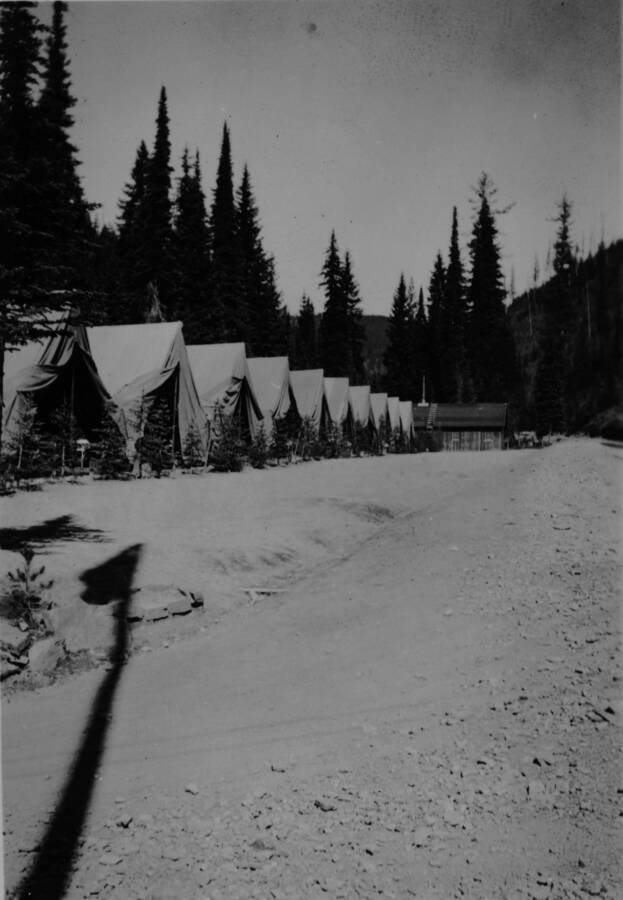 Ina Quist Davis's handwritten picture caption in her photo album says, "The CCC boy's [sic] tents in Beaver. The road leads through Beaver back to Clark's Fork."