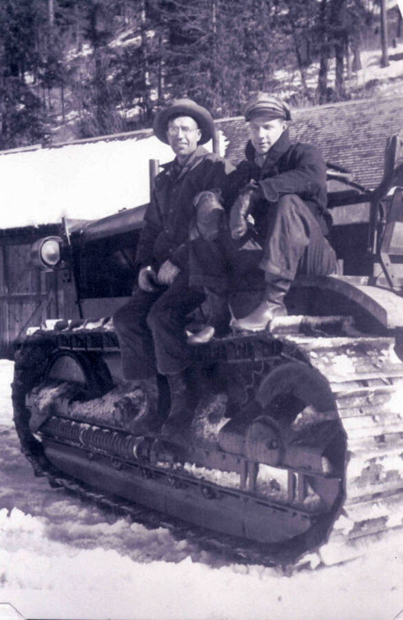 Men with a 'cat' in winter at Camp Red River, Idaho.