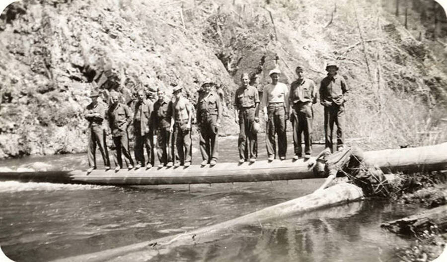 Back of photo reads: 'Left to right unidentified man, unidentified man, unidentified man, unidentified man, Chester Webster, Benson Williams, Homer Jacobs, unidentified man, D. Lepper, E. Overdorf. Downstream from Magee 1935.'