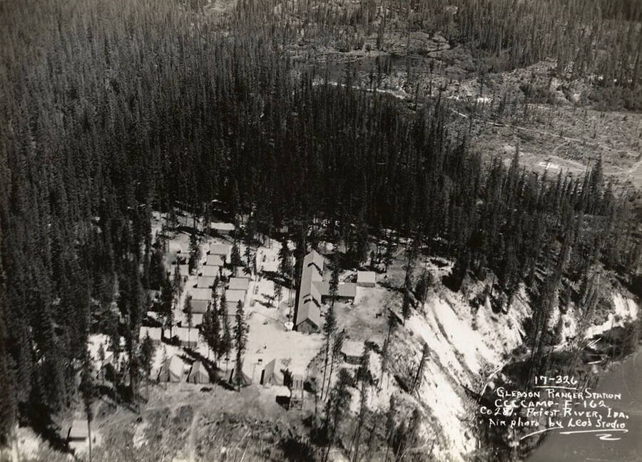 Aerial view of Gleason Ranger Station CCC Camp, F-162. Writing on the photo reads: 'Gleason Ranger Station CCC Camp F-162 Company 281 Priest River, Idaho Air photo by Leo's Studio'.