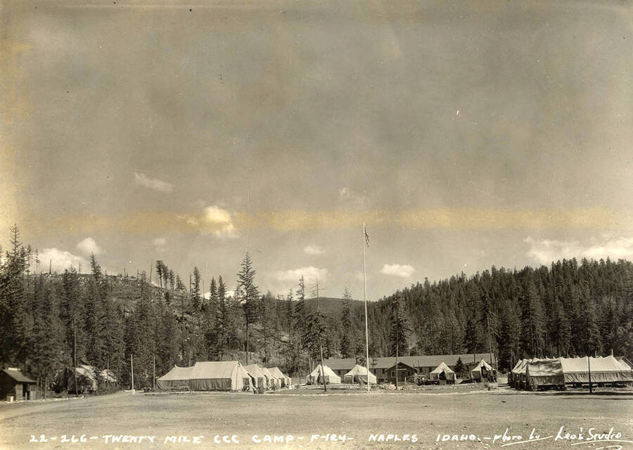 View of Twenty Mile CCC Camp, F-124. Writing on the photo reads: 'Twenty Mile CCC Camp F-124 Naples, Idaho. Photo by Leo's Studio'. Back of photo reads: 'Kanisku'.