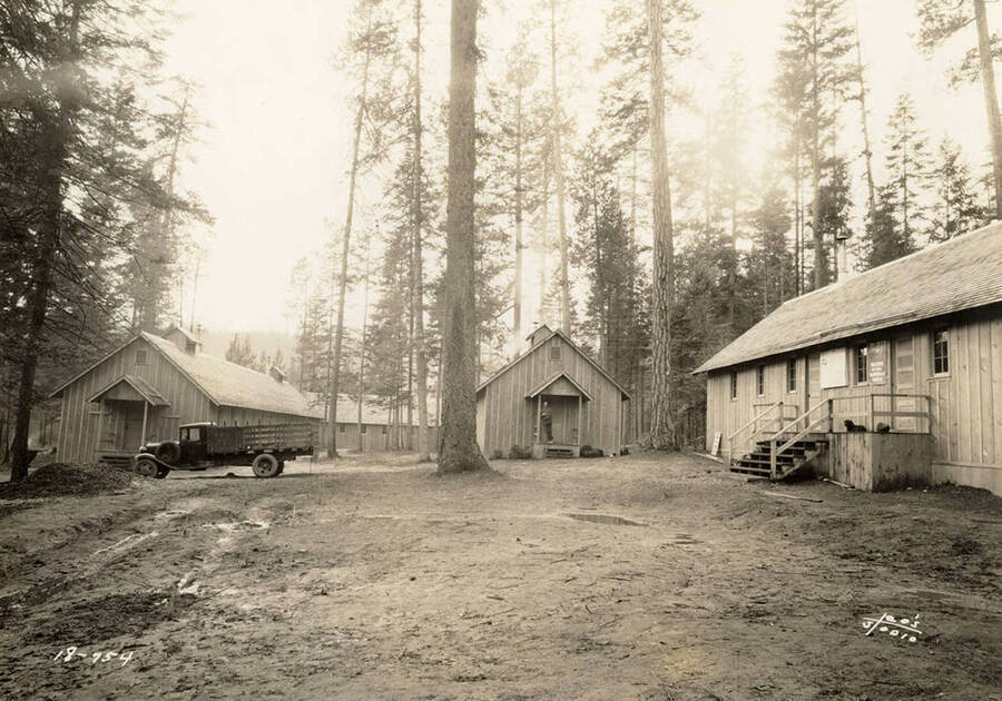 View of CCC Camp Heyburn, SP-1, and a truck. Back of photo reads: 'Heyburn'.