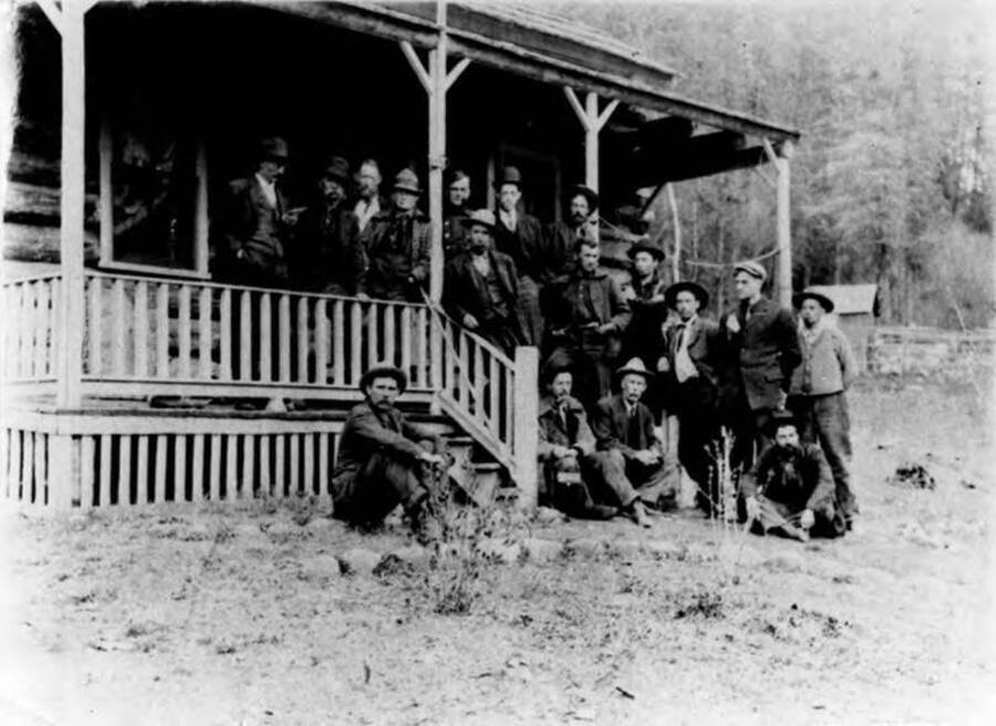 Back of photo reads: 'Selway N.F. The 'Bunch' - Selway Ranger Meeting, April 11, Major Fenn sitting on bottom steps (w/tie) collection: L Hartig.