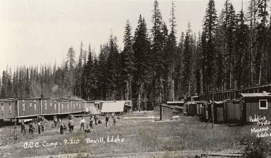 View of CCC Camp Bovill, P-210, company 1279, near Bovill, Idaho. Writing on the photo reads: 'CCC Camp P-210 Bovill, Idaho. Hodgins Foto Moscow, Idaho'.