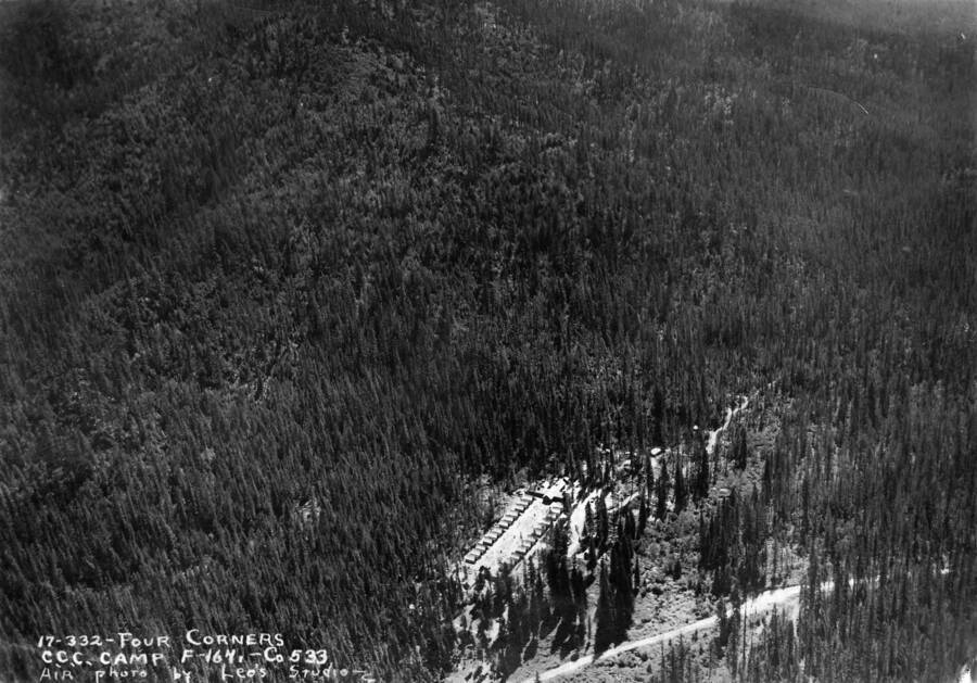 An aerial view of Camp Four Corners, F-164, Company 533, Priest River, Idaho. Writing on the photo says: 'Four Corners CCC Camp F-164 Co. 533 Air photo by Leo's Studio.'