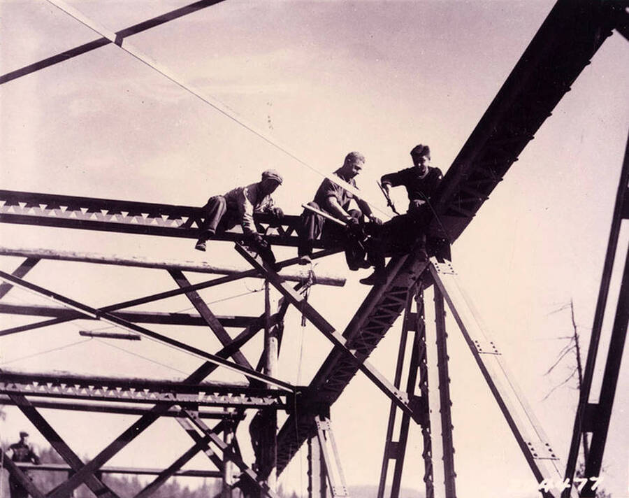 CCC men working atop the McPherson bridge. Bridge was built over the Coeur d'Alene River and mostly done by the CCC.
