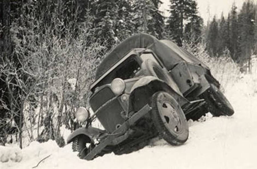 CCC truck on the side of the road during winter. Back of photo reads: 'Mary Neil Kaniksu'.