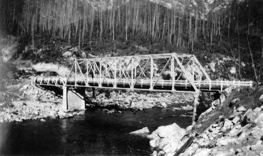 View of a bridge below CCC Camp Bungalow, F-193, over the North Fork of the Clearwater River.