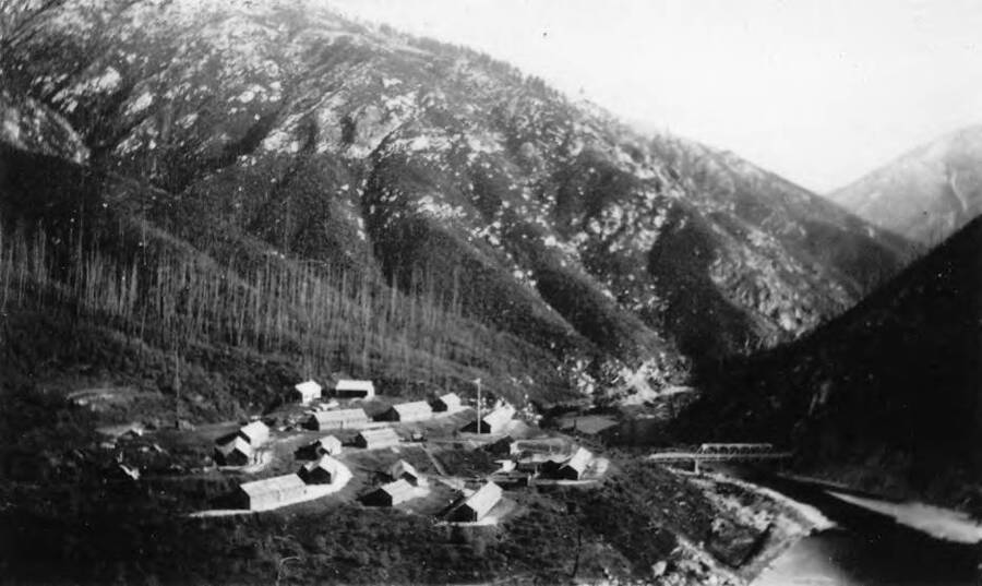 View of CCC camp Bungalow F-193, Company 603, Bungalow Bridge, the North Fork of the Clearwater River, and the surrounding area.